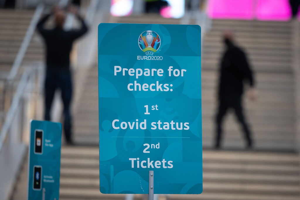 LONDON, ENGLAND - JUNE 18: A sign warns approaching England and Scotland fans of Covid status and ticket inspections as they approach Wembley Stadium on June 18, 2021 in London, England. England v Scotland is not only the oldest fixture in the world, they have also played one another more than any other two international teams. Their first encounter was played in 1872 at Hamilton Crescent, Glasgow and their 115th match today at Wembley for Euro 2020. (Photo by Leon Neal/Getty Images)
